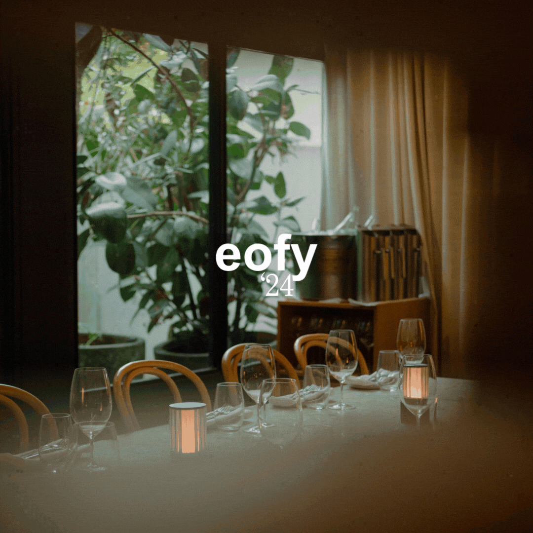 promotional material for NOUR Restaurant Sydney End of FInancial Year Corporate lunch and dinner featuring a neatly-arranged dining table covered in white cloth and relaxing ambience