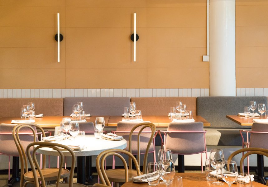 Bright and modern dining setup at NOUR Restaurant Sydney with elegant table arrangements and chic decor.